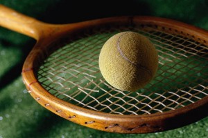 Tennis ball and racket with broken string